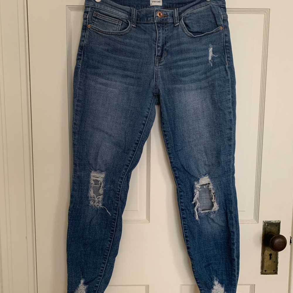 Sneak Peak distressed denim jeans.